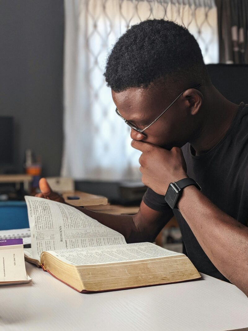 A boy reading the Bible